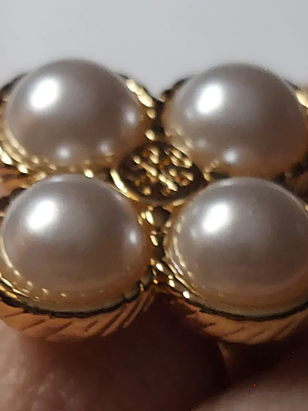 Tory Burch Rope Clover ring featuring four faux pearls set in gold-tone metal